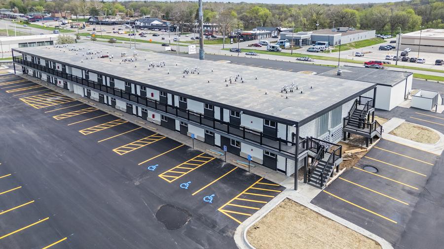 Aerial view of the building and the striped parking lot.